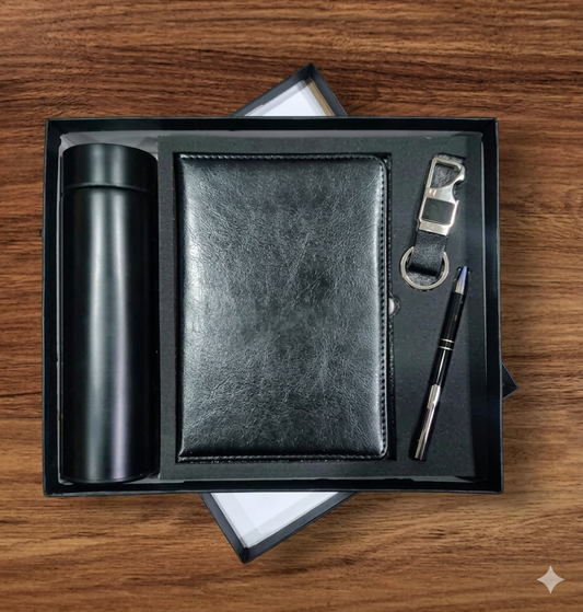 Black leather notebook, pen, bottle opener, and tumbler set on a wooden surface