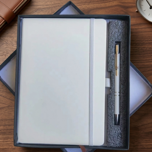 Notebook and pen set in a box on a wooden surface